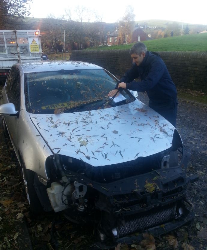 One of our Operations Supervisor's attaching a notice to a car today that meets the criteria of being abandoned 