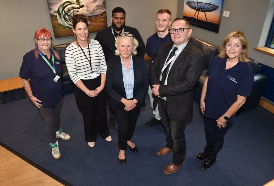 group of people smiling including alyson barnes council leader